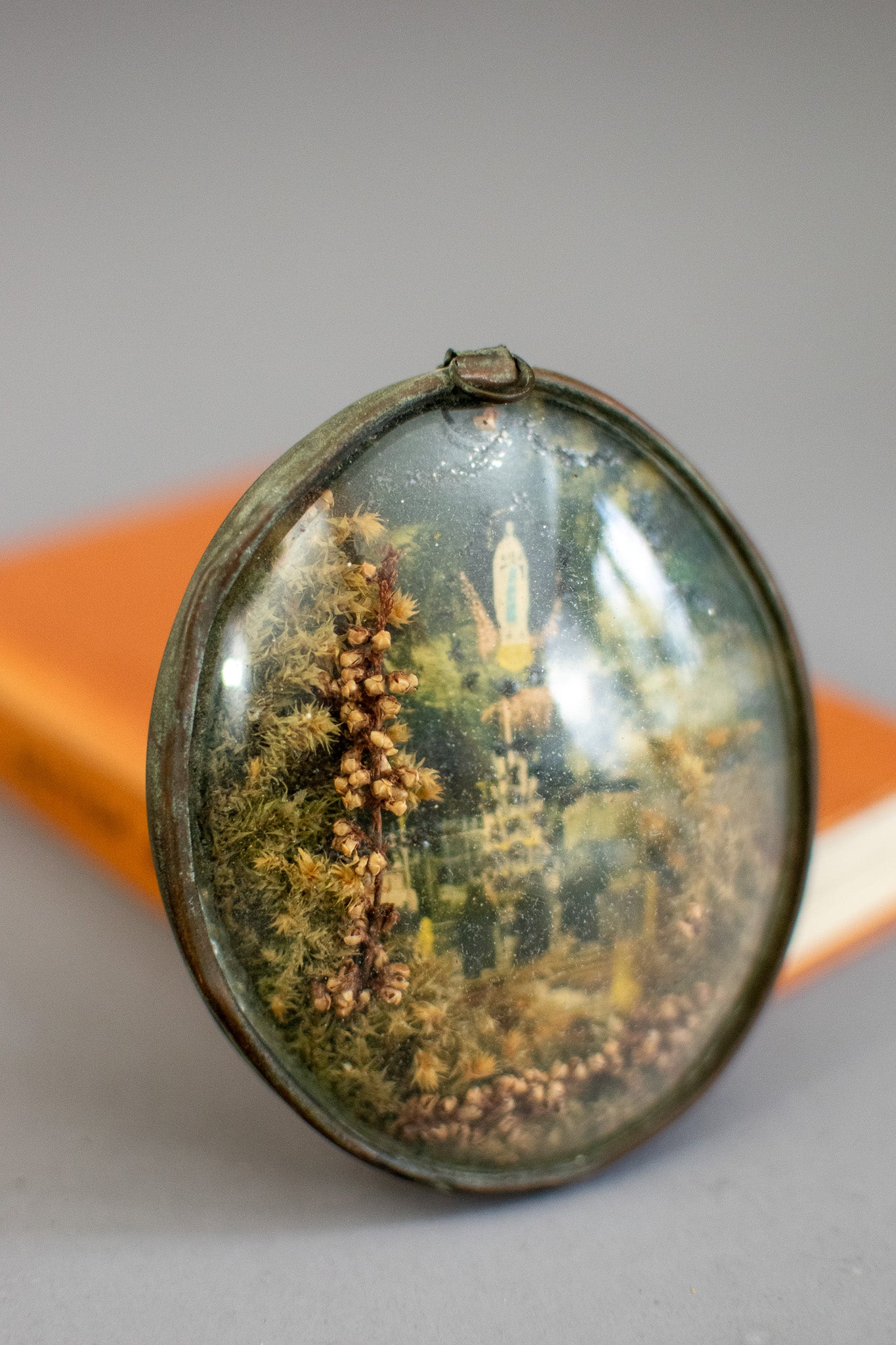 Antique Victorian Glass Oval Shaped Diorama of Our Lady of Lourdes With Dried Flowers and Glitter