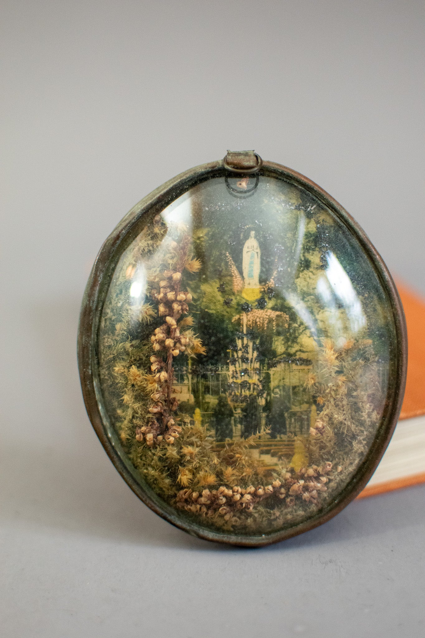 Antique Victorian Glass Oval Shaped Diorama of Our Lady of Lourdes With Dried Flowers and Glitter