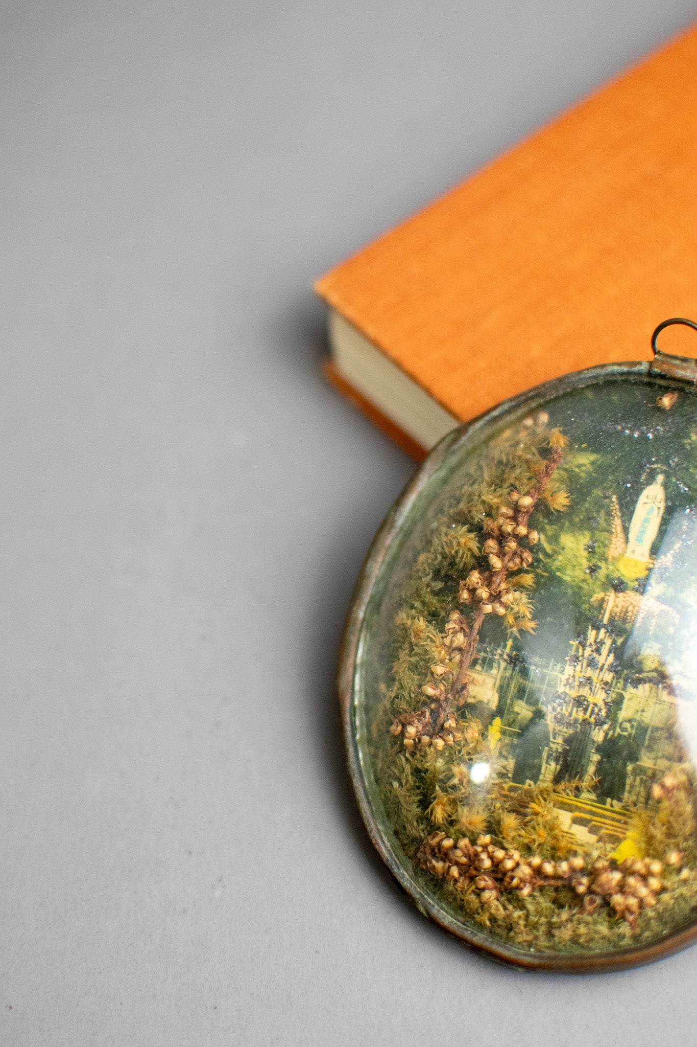 Antique Victorian Glass Oval Shaped Diorama of Our Lady of Lourdes With Dried Flowers and Glitter