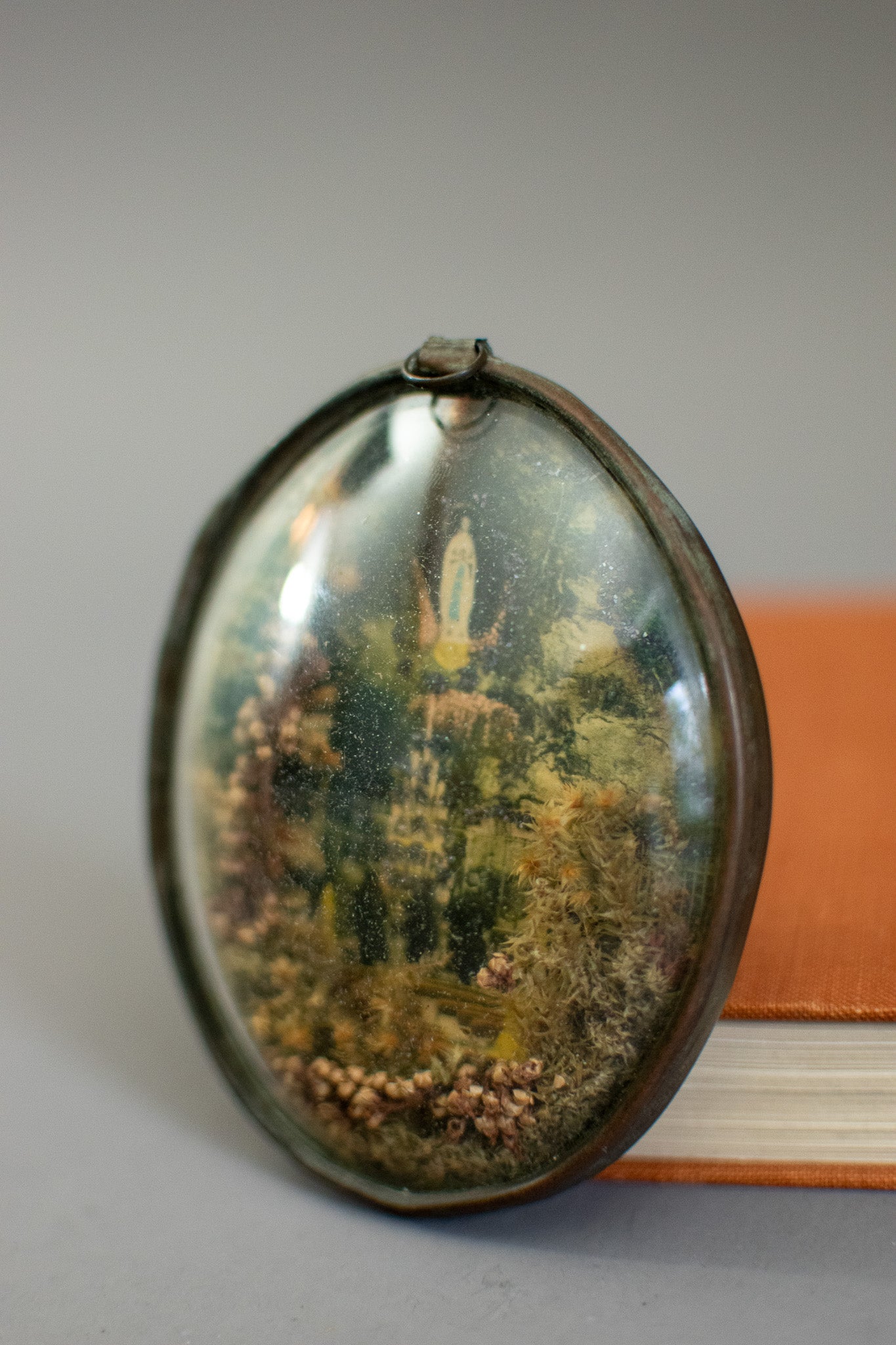 Antique Victorian Glass Oval Shaped Diorama of Our Lady of Lourdes With Dried Flowers and Glitter